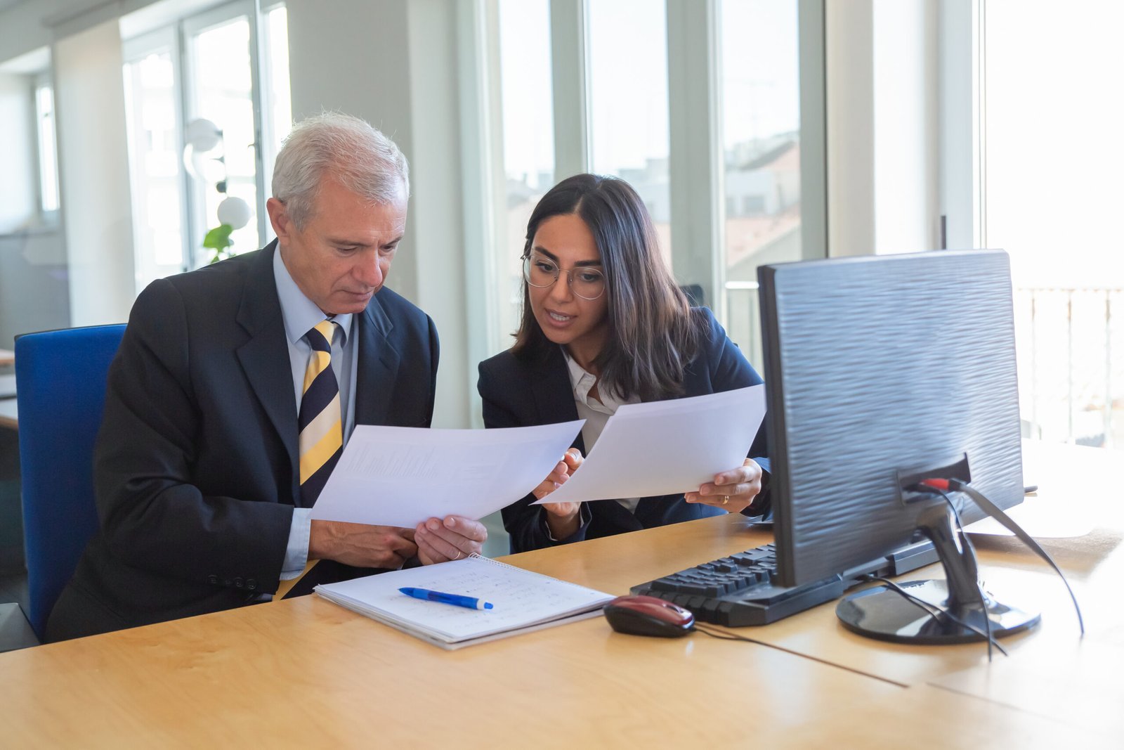 female professional explaining document details